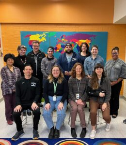 Specials and Wheels Teacher Team Picture. Pictured from left to right: (back row) Janet Kingsley, Meghan Fatouros, William Heim, Victor Spadaro, Michael Collazos, Lauren Muscarello, Basma Joseph, Renita Upshur, (front row) Joe Reed, Giovanna Koesterer, Kathi Aagaard, Allison Barnes