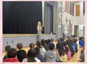 Ms. Virginia speaking to students at Abingdon in the gym